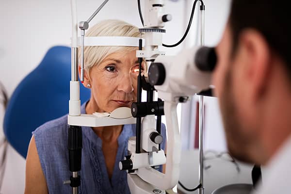 An old woman has an eye test before getting glaucoma treatment